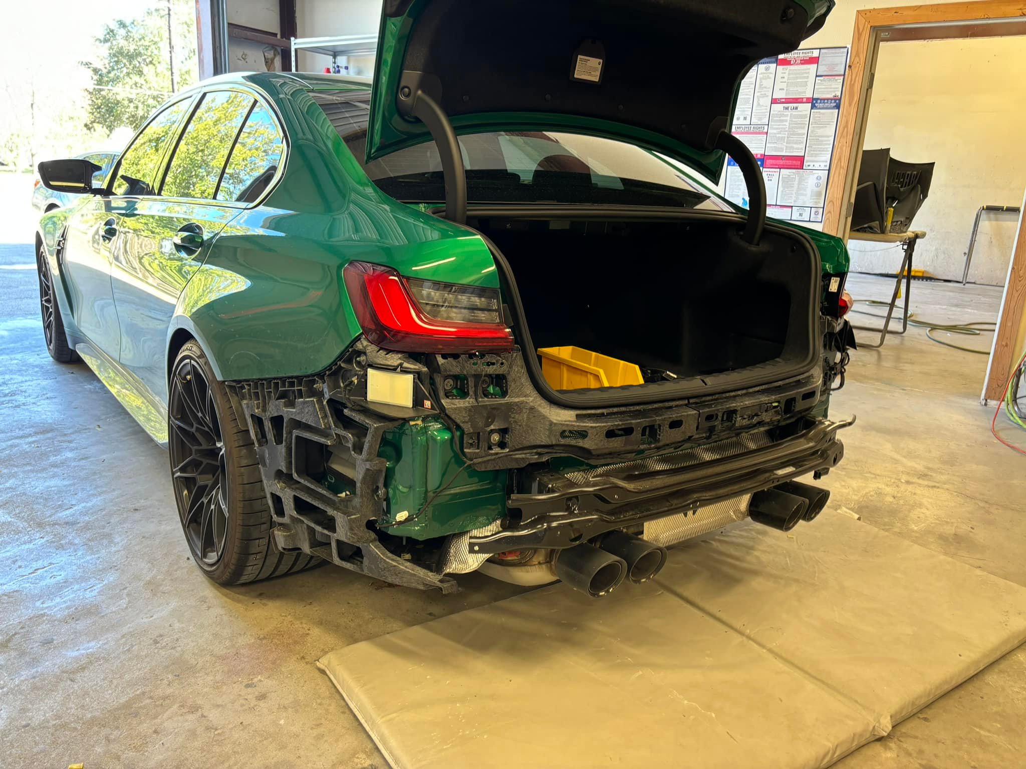 BMW with collision damage before body repair at Eric's Custom Finishes
