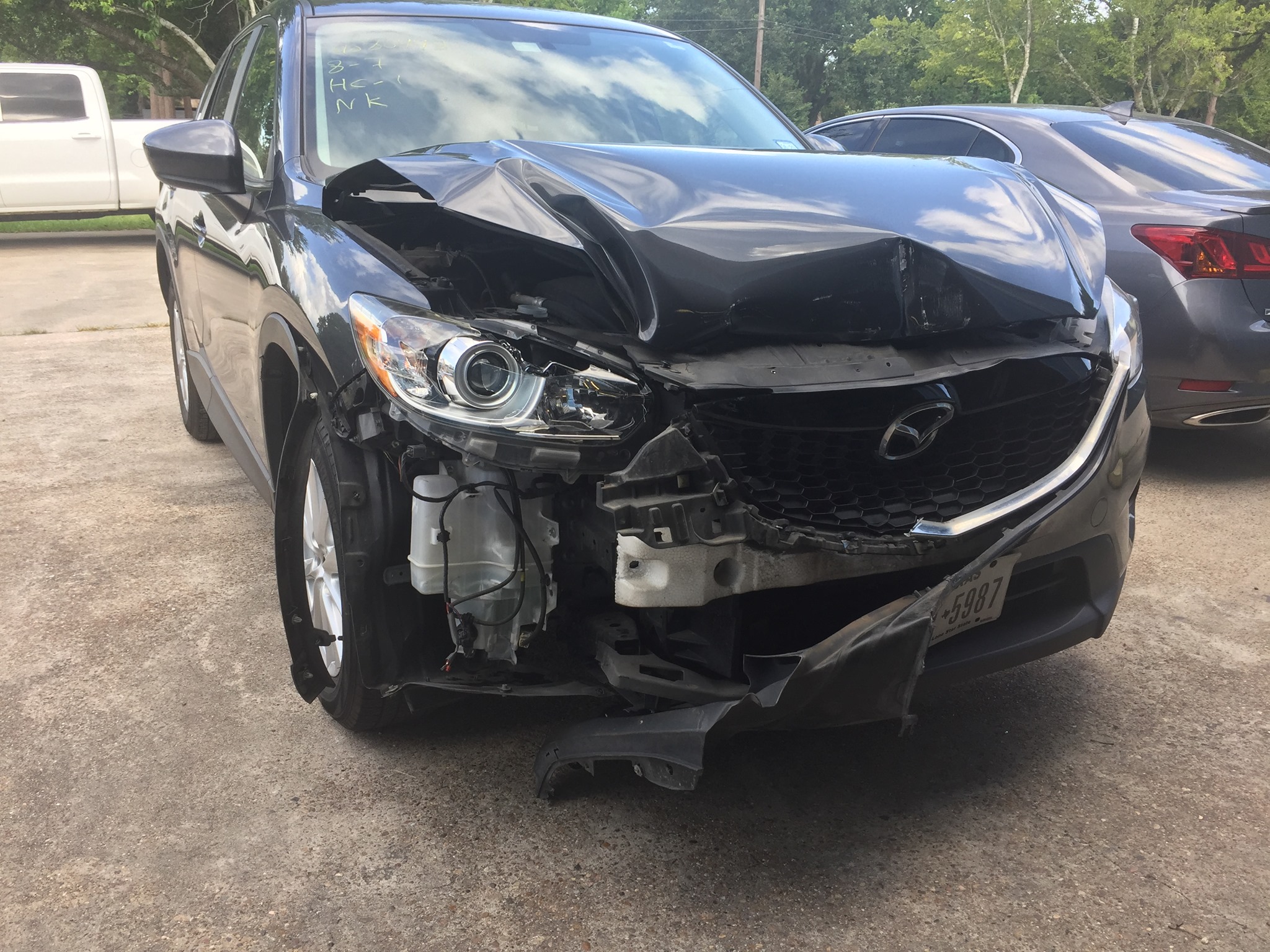 Mazda CX-5 with body damage before collision repair
