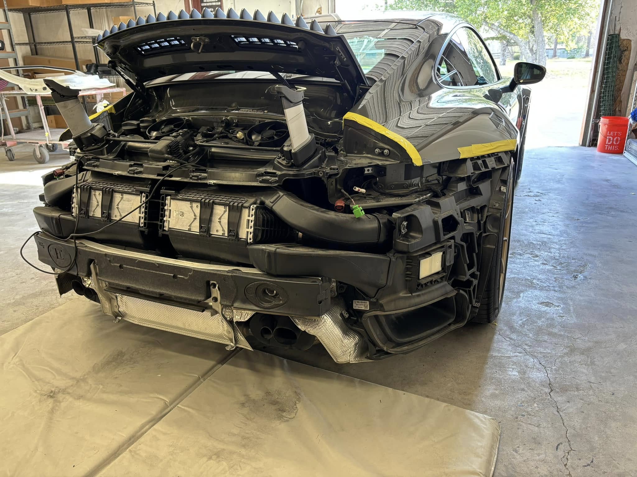 Porsche with body damage before paint and collision repair