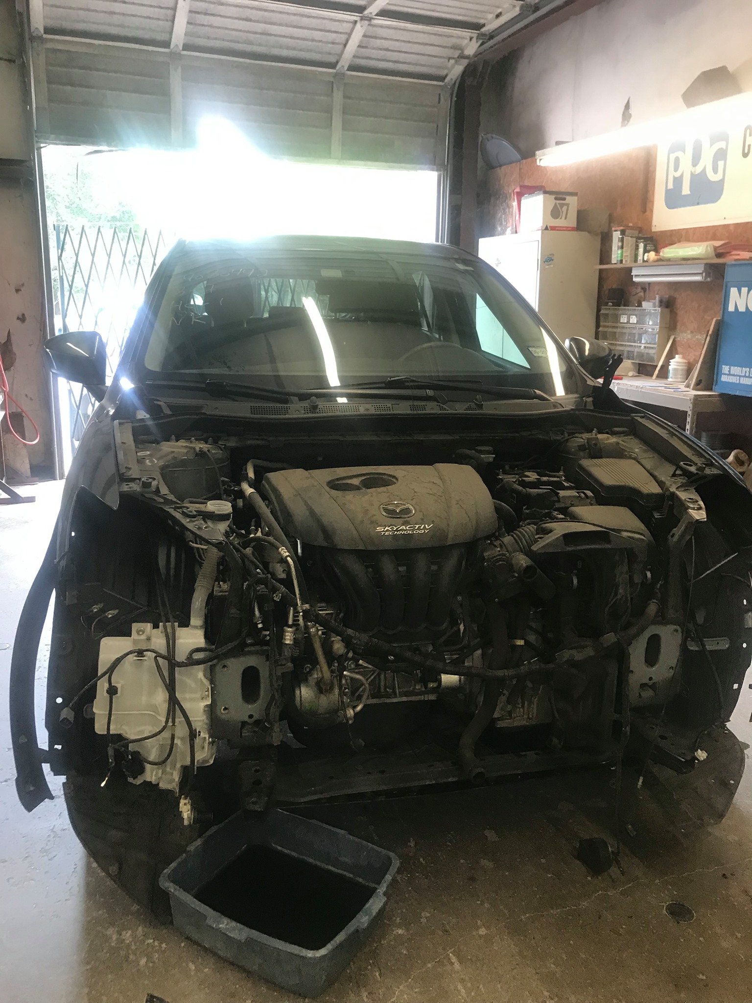 Mazda CX-5 during body repair with primer applied